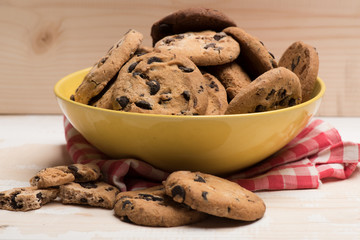 Chocolate chip cookies in yellow bowl