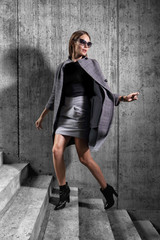 high fashion portrait of young elegant woman outdoor.