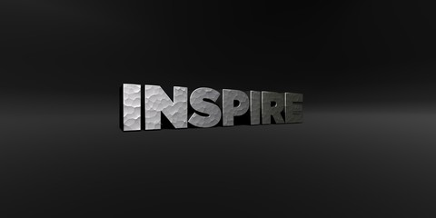 INSPIRE - hammered metal finish text on black studio - 3D rendered royalty free stock photo. This image can be used for an online website banner ad or a print postcard.