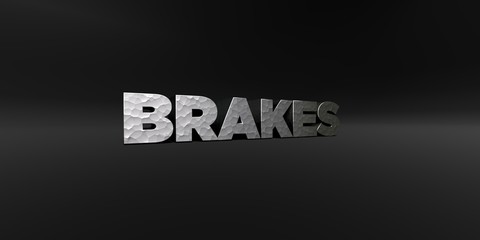 BRAKES - hammered metal finish text on black studio - 3D rendered royalty free stock photo. This image can be used for an online website banner ad or a print postcard.