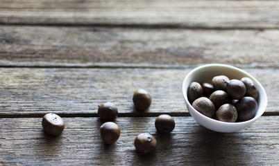 roasted chestnuts on wood background