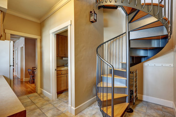 Small hallway interior with spiral metal staircase