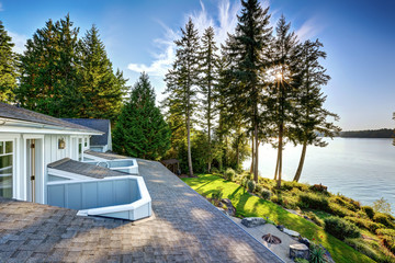 Exterior of waterfront house with a pier and perfect water view.