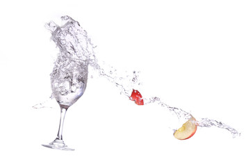 apple spashing into wine glass
