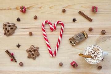 Christmas cookies with festive decoration on wooden background