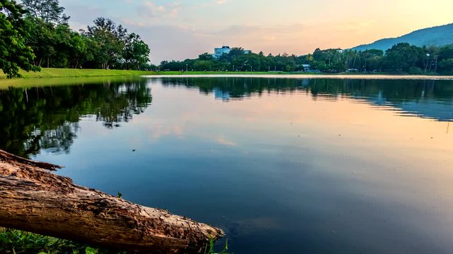 (4k) Time lapse of beautiful landscape in the everning with reflected on water in Lakes, trees and cloudy sky.