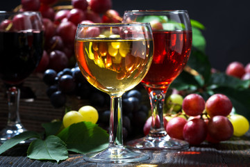wine glasses on a dark wooden background, closeup