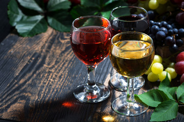 wine glasses on a wooden background, horizontal