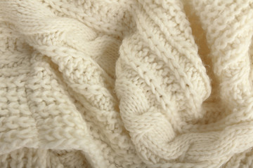 Fototapeta na wymiar Close-up of a piece of white knit fabric