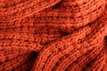 Close-up of a piece of orange knit fabric
