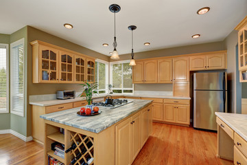 Maple storage combination and large island in the kitchen room