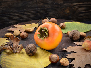 Fresh persimmon on a wooden table