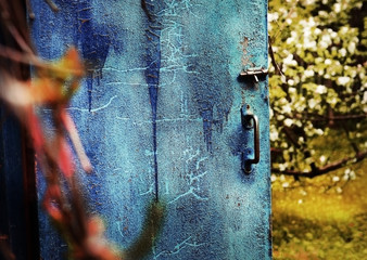 old door with cracked blue paint