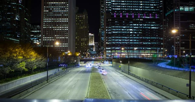 Chicago, Illinois, USA - view from BP Pedestrian Bridge at Millennium Park at S Columbus Drive with traffic facing north at night - Timelapse without motion
