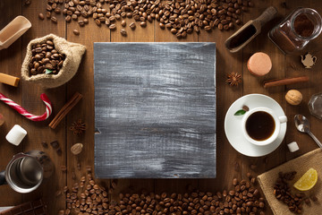 cup of coffee and ingredients on wood