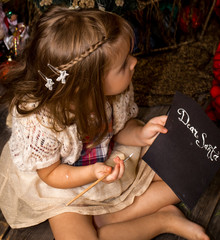 Little girl writes letter to Santa