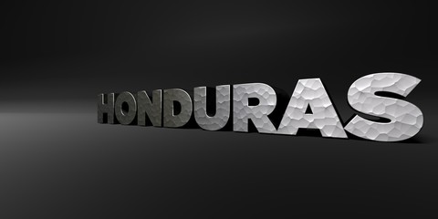 HONDURAS - hammered metal finish text on black studio - 3D rendered royalty free stock photo. This image can be used for an online website banner ad or a print postcard.
