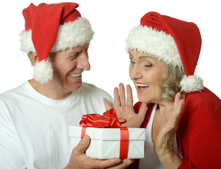 Senior couple with Christmas present