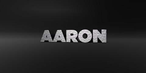 AARON - hammered metal finish text on black studio - 3D rendered royalty free stock photo. This image can be used for an online website banner ad or a print postcard.