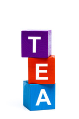 wooden toy cubes with letters. Tea