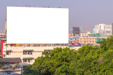 large blank billboard on road with city view background