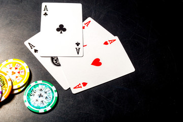 Obraz premium poker chips and cards on black background