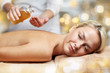 close up of woman lying on massage table in spa