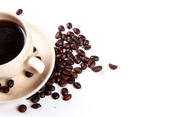 Coffee beans in coffee cup isolated on white