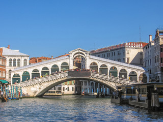 the Rialto Bridge, the main and biggest bridge of Venice, popular landmark of Venice. - obrazy, fototapety, plakaty