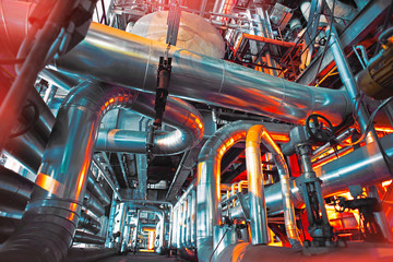 Equipment, cables and piping in red tones