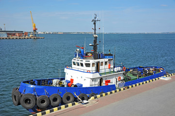 Tugboat in harbor quayside