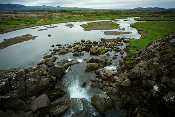 Pingvellir national park, Iceland. Green valley with river.