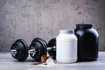 Plakat Classic black dumbbells with protein jars