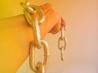 hand chained with iron chain
