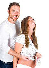 Pregnant young woman with man in studio