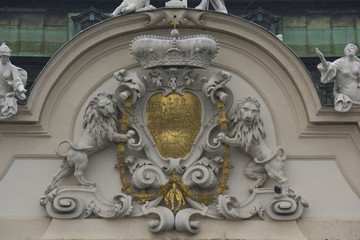 Architectural close up of the facade od Schloss Belvedere in Vienna, with its coat of arms with lions