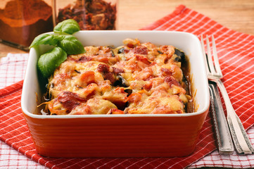 Casserole with roasted eggplants stuffed with minced meat.