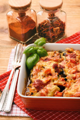Casserole with roasted eggplants stuffed with minced meat.