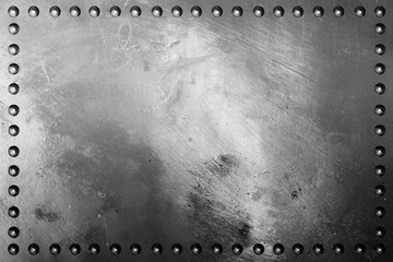Dark metal plate texture with rivet.