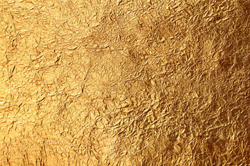 Shiny yellow leaf gold foil texture background