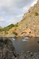 Three boats in the small marine bay. Mallorca, Spain.