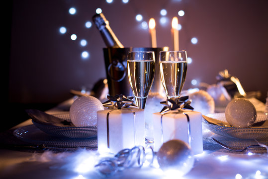 Dim Light White Silver And Blue Romantic New Year Eve Or Christmas Table In A Luxury Restaurant With Champagne