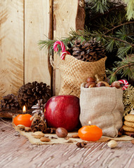 New Year or Christmas composition with walnuts, mulled wine, hazelnuts