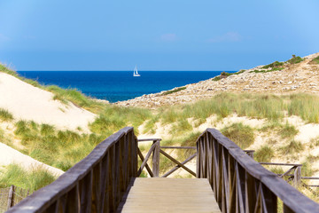 Wooden footbridge to the sand dunes at the seaside - 2130