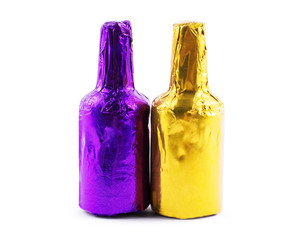 bottles in foil on a white background