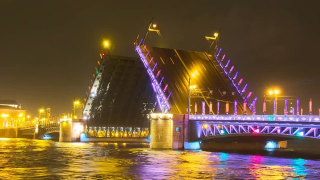 Closing the Palace Bridge on Neva river. Iconic view of St. Petersburg. Russia North Capital Saint Petersburg classic symbol. Vessel and barges under the bridge. Starting to rain. 4K timelapse video