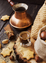 Turkish coffee in a small cup, cookies, selective focus