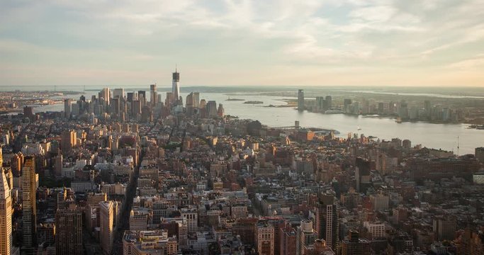 Manhattan, New York City, USA - view from the Observation Deck of the Empire State Building facing south towards One World Trade Center at sunset - Timelapse with pan right to left