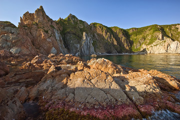 Coastal, sea cliffs at sunset.
