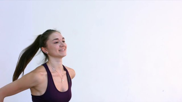 Step Aerobic. Tops. Slow motion. Young women in an aerobics class
